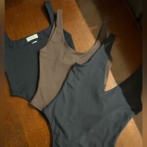 All three (3) Babaton Black and Brown Aritzia Bodysuits